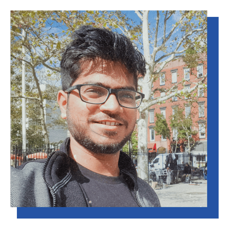 Adobe Coldfusion Summit India - A Summary Of All Previous Summits 23 Young Man Wearing Glasses Outdoors In City Park.