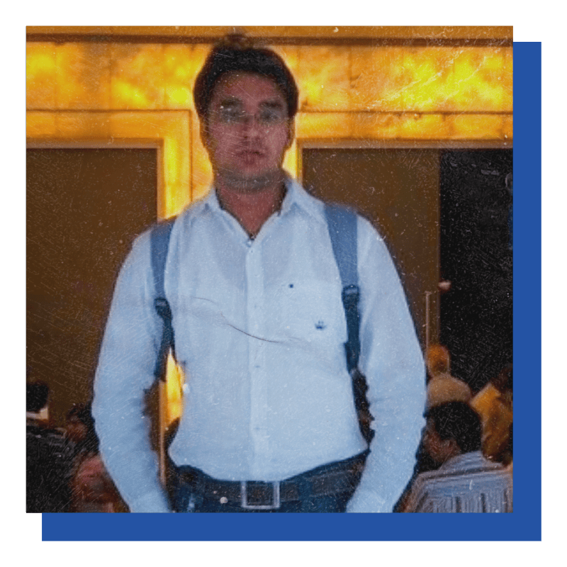 Adobe Coldfusion Summit India - A Summary Of All Previous Summits 30 Man With Backpack Standing Indoors Against Glowing Yellow Background.