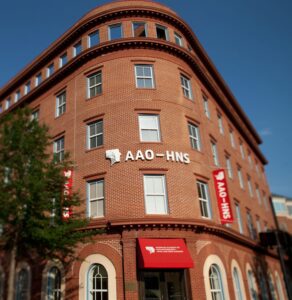 Modern brick building hosting the American Academy of Otolaryngology event.